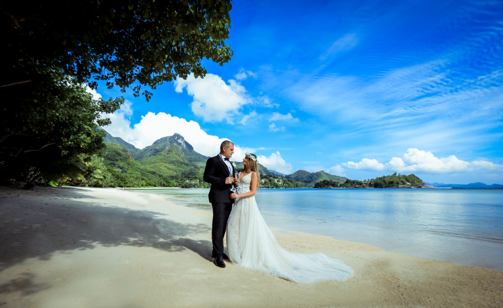 An elegant gentleman has just married a beautiful lady in the most incredible place on earth!